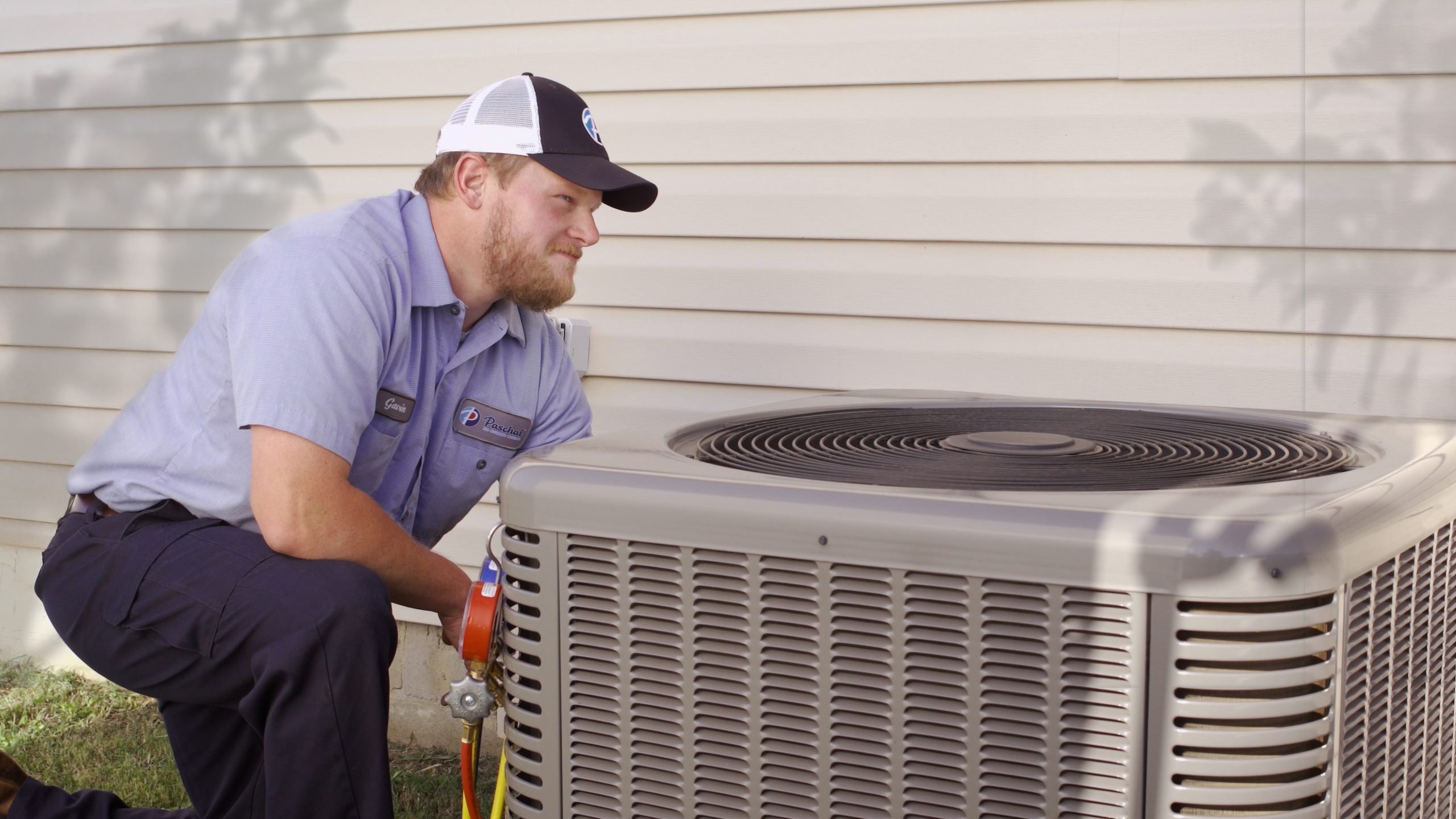 Licensed Paschal HVAC technician performing AC tune-up inspection