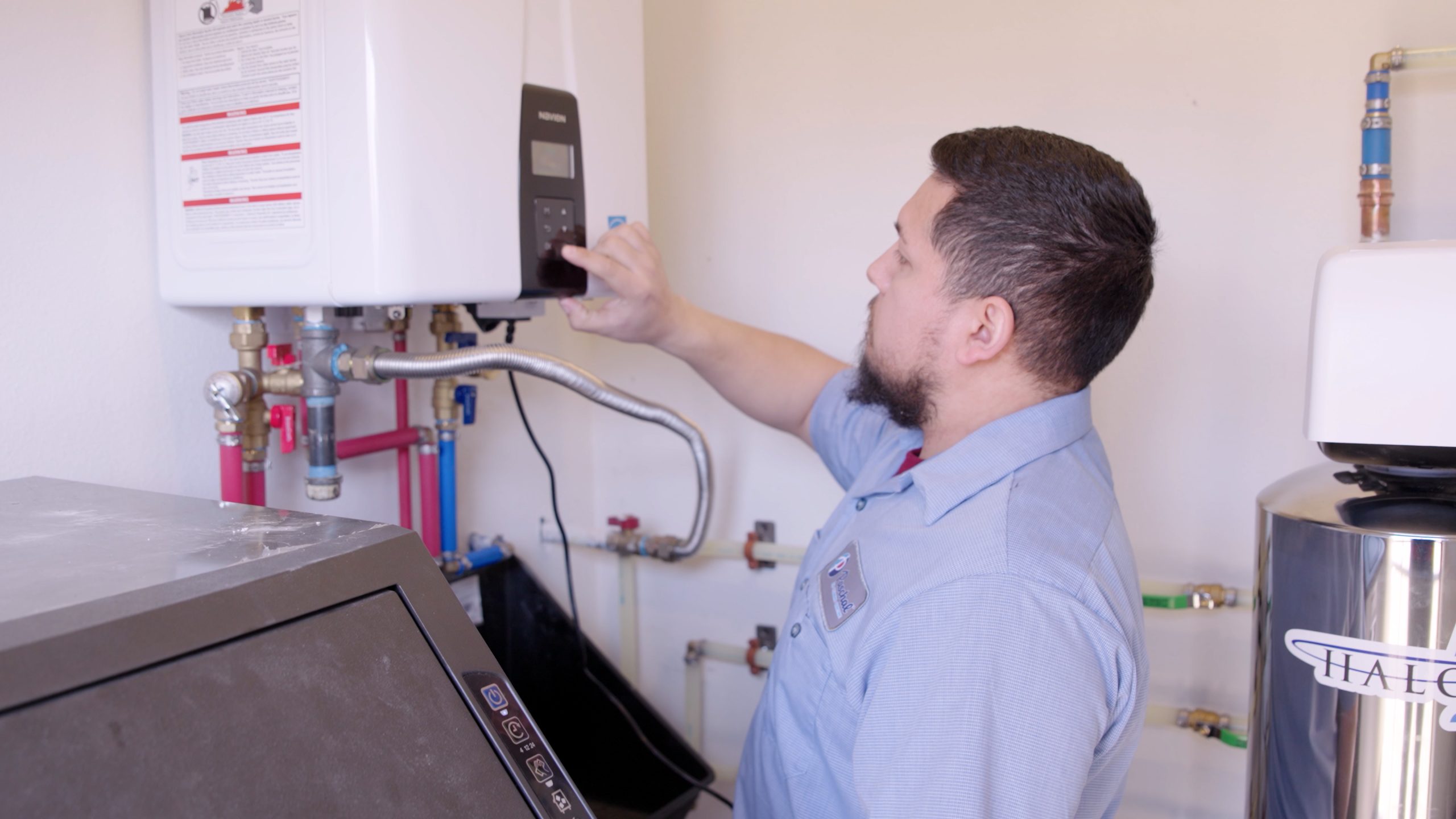 Licensed plumber performing a Manual J load calculation