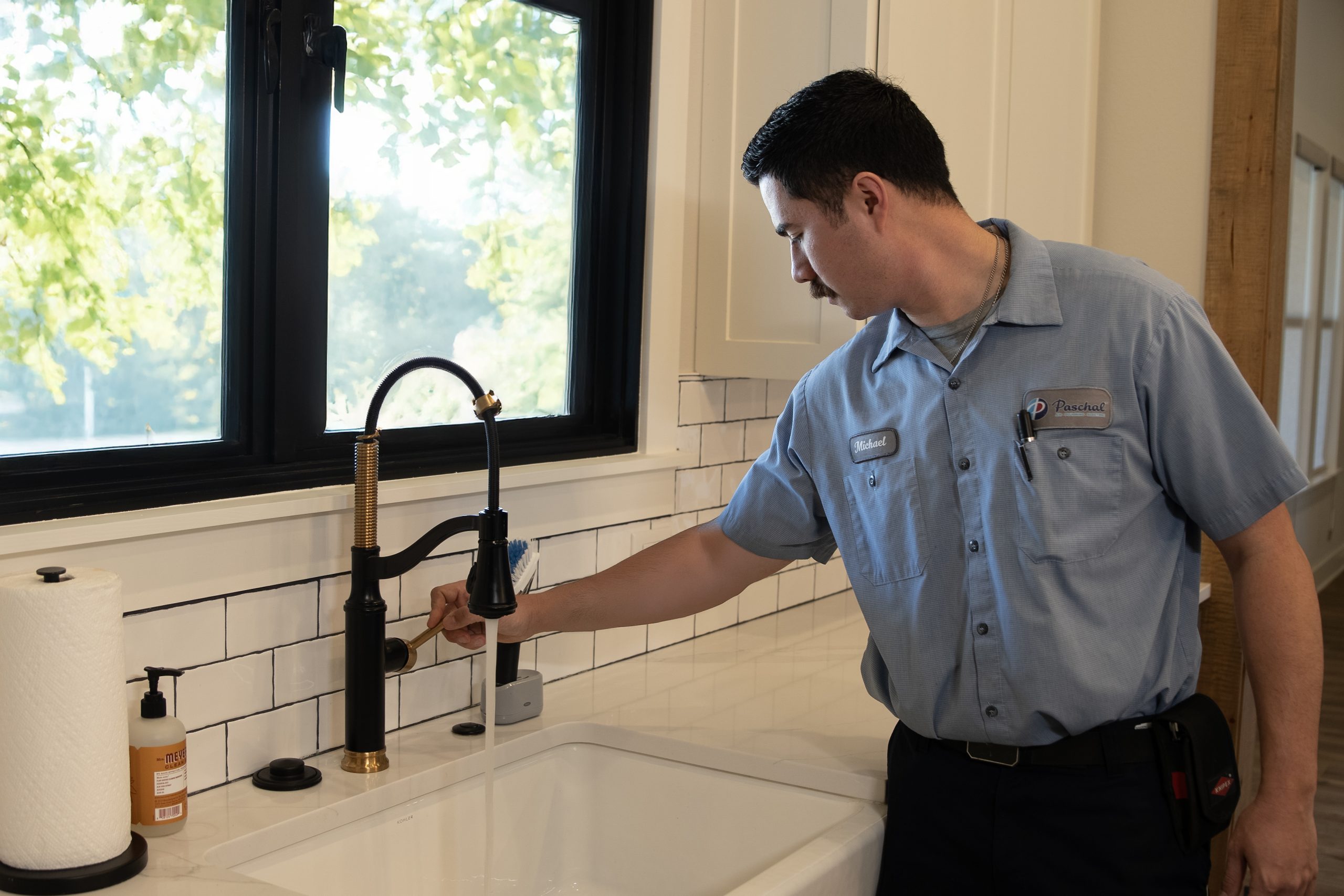 Plumber diagnosing a residential water heater